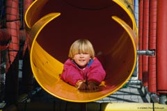A boy on a playground; Actual Size=240 pixels wide